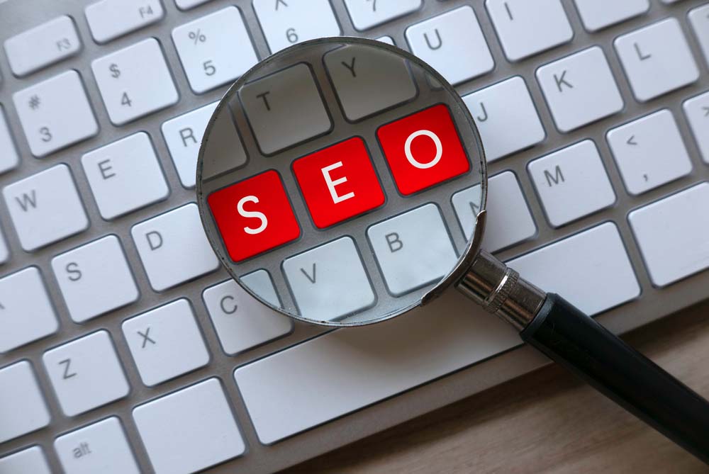 Red key written with SEO Search Engine Optimization