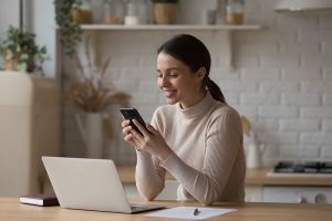 Smiling person browsing through a website