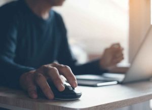 man clicking a mouse