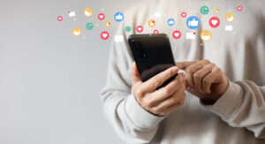 smartphone displaying multiple social media app logos in vibrant colors