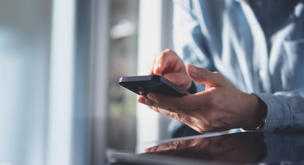 person looking at a landing page on a mobile device